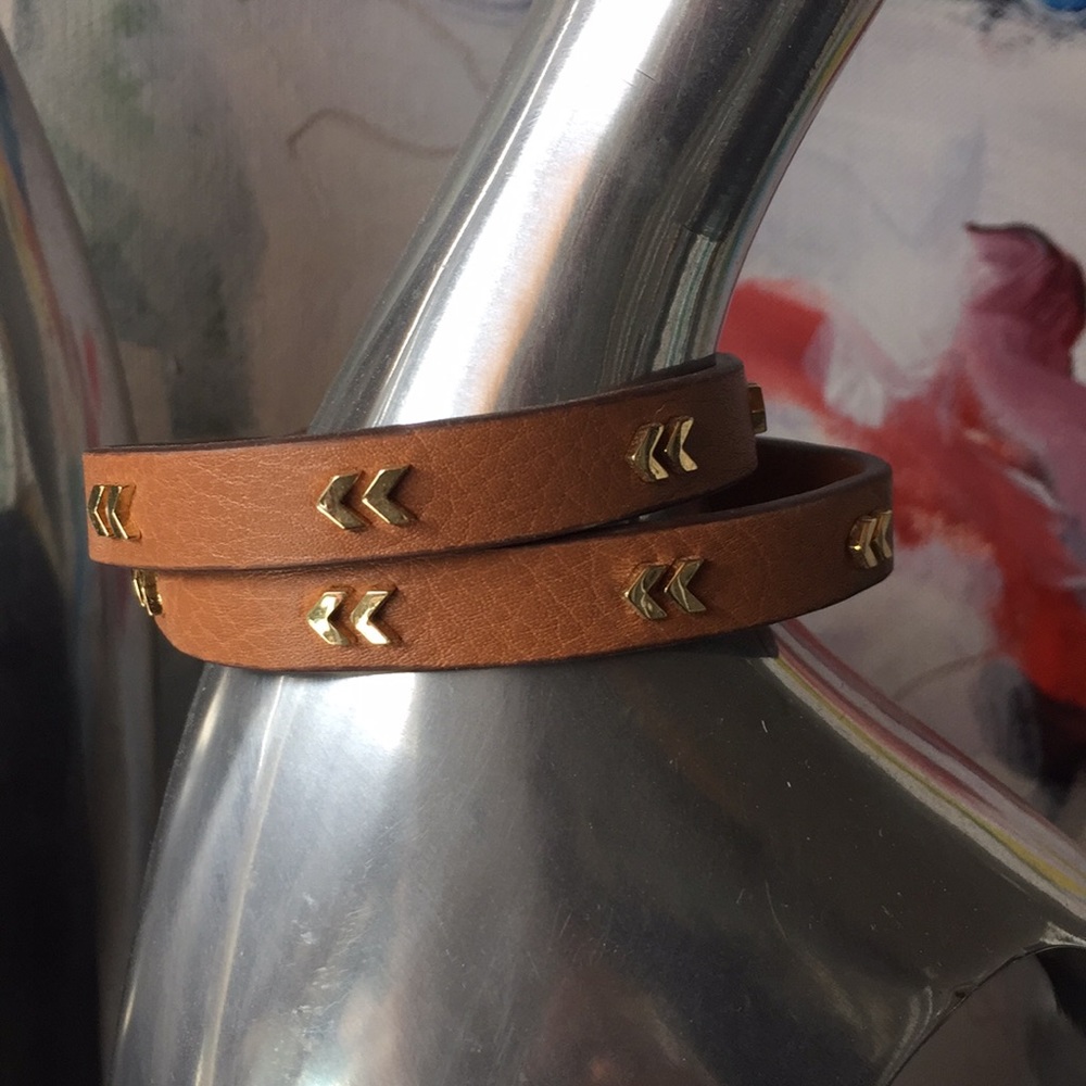 Brown leather with gold chevron wrap bracelet.